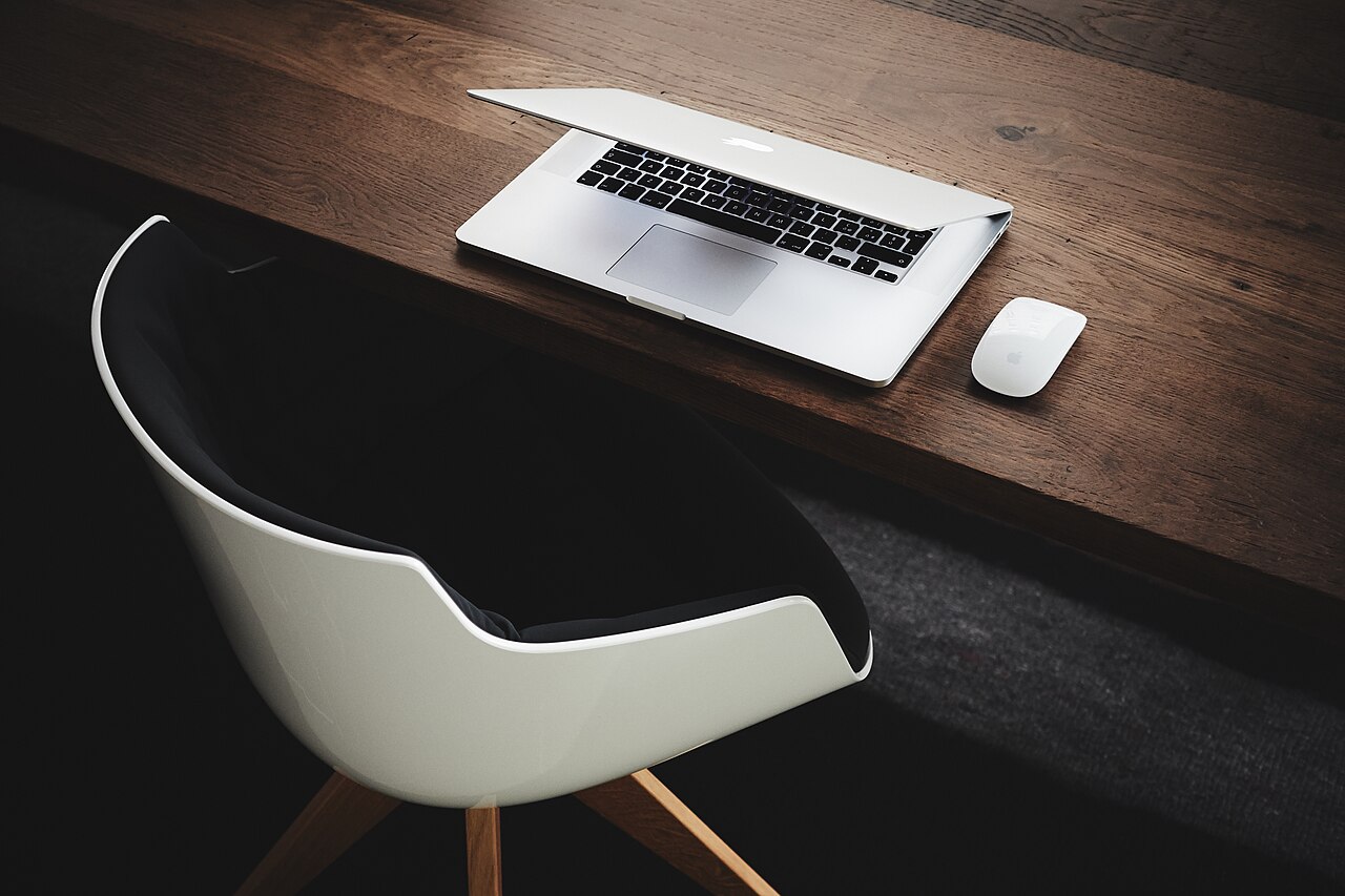 A laptop and accessories on a desk